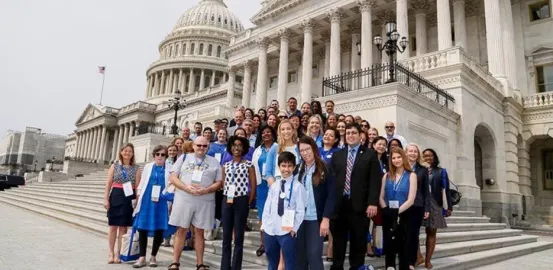 Group of advocates standing on the Capitol steps