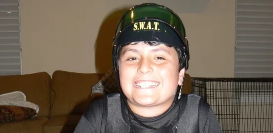 Ethan Hirschberg at age 11 wearing a SWAT team costume