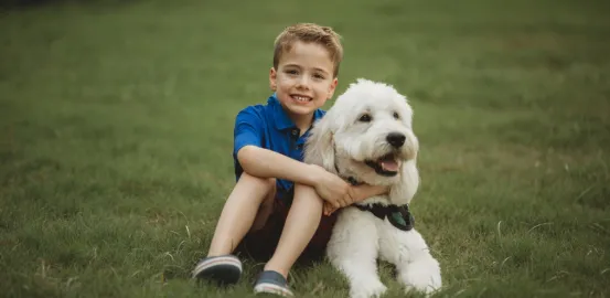 Jacob and Reid, a little boy hugging his dog