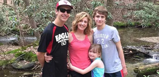 Kathy Hooven and her children on a hike