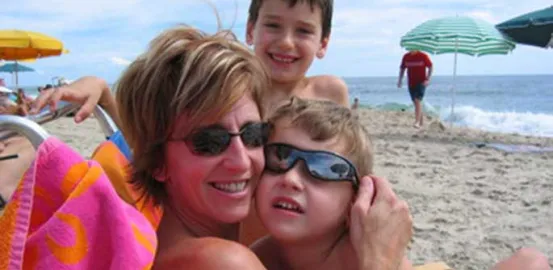 Kathy Hooven and her children on the beach