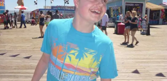 Kimberlee Rutan McCafferty's son Justin on the boardwalk