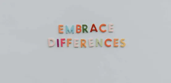 Letter magnets on a refrigerator that spell out Embrace Differences