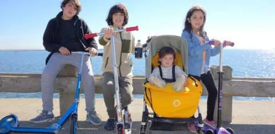 Lulu Mann and her family riding scooters