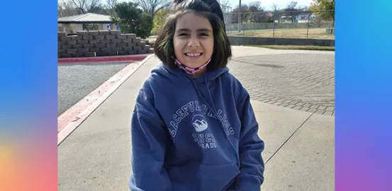 Sofia wearing a blue hoodie