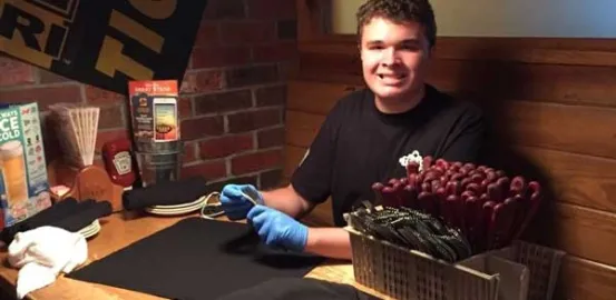 autistic teen working at a restaurant