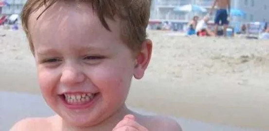 blonde toddler on the beach