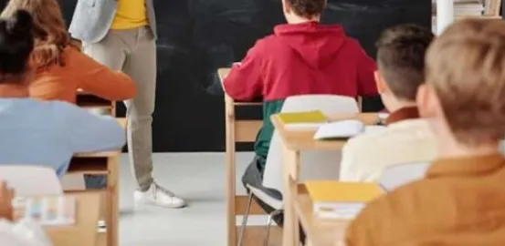 children in a classroom sitting at desks