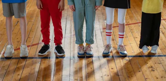 children lined up in gym class