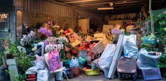 house with bags of and boxes stacked outside