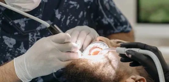 man with a beard getting dental work done