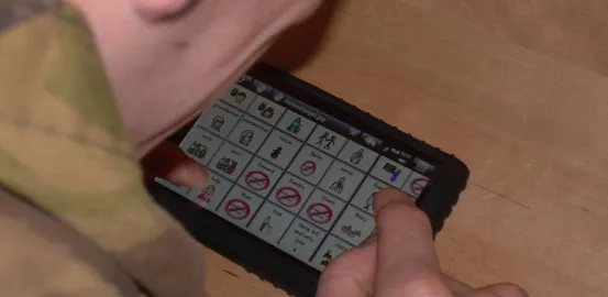 teen using an AAC device