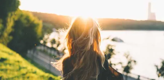 woman looking at a body of water