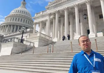 Vincent Feng standing in front of Capitol steps in DC