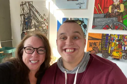 Amy Hess and her son in an art gallery