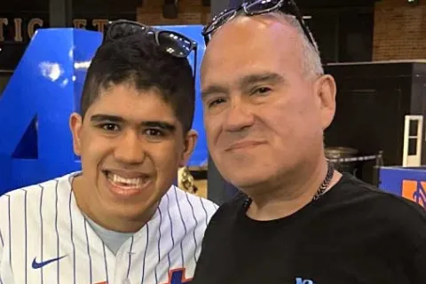 Dom and Michael wearing a Mets shirt