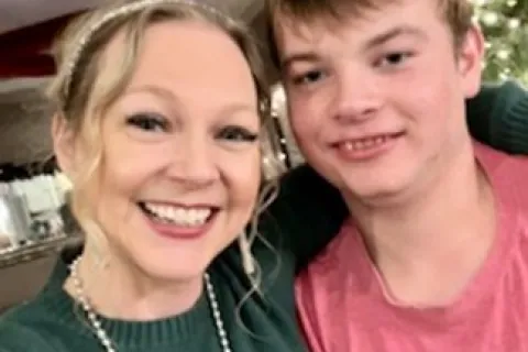 J-Jaye and her son, Jackson in front of a Christmas tree