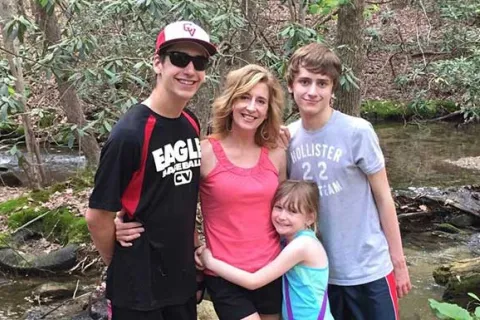 Kathy Hooven and her children on a hike