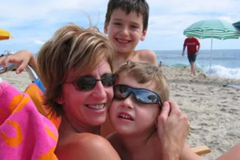 Kathy Hooven and her children on the beach