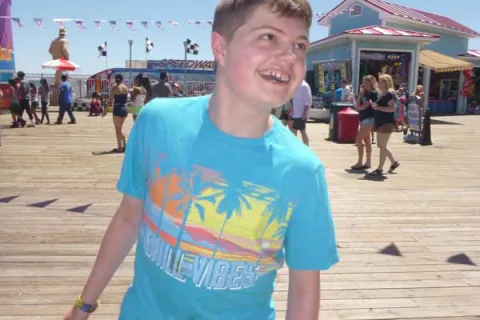 Kimberlee Rutan McCafferty's son Justin on the boardwalk