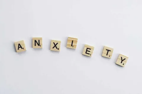 Scrabble letters spelling out the word anxiety