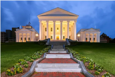 Virginia state capitol building lit up in the evening