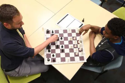 aerial view of two men playing chess