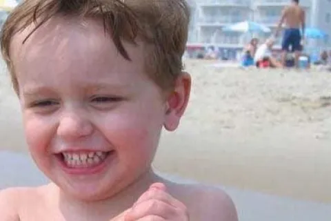 blonde toddler on the beach