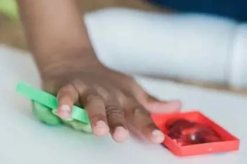 child touching autism sensory toys