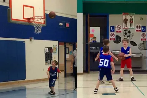 children playing basketball indoors