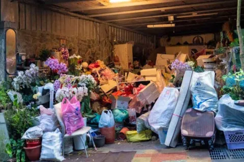 house with bags of and boxes stacked outside