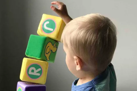 toddler playing with blocks