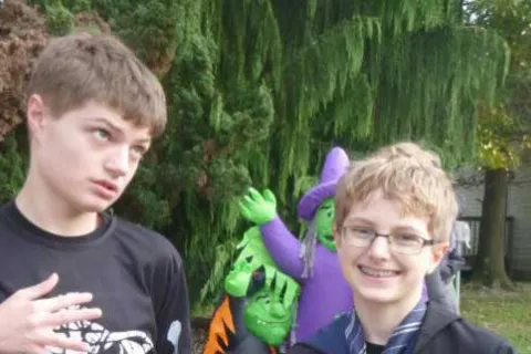 two young boys in Halloween costumes