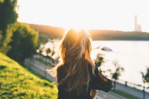 woman looking at a body of water