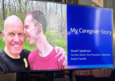 presentation TV with opening slide featuring photo of Stuart and his son Zak