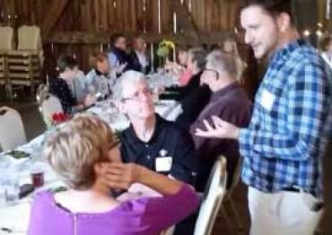 Jon talking to people at a Fundraiser