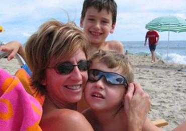 Kathy Hooven and her children on the beach