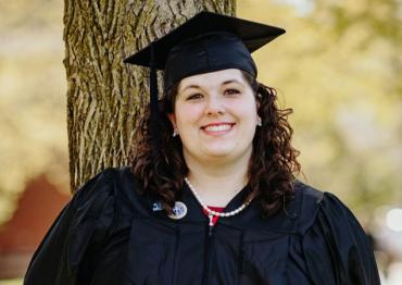 Gianna wearing her cap and gown at graduation