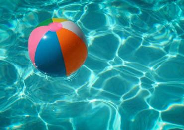 blow up beach ball floating in a pool