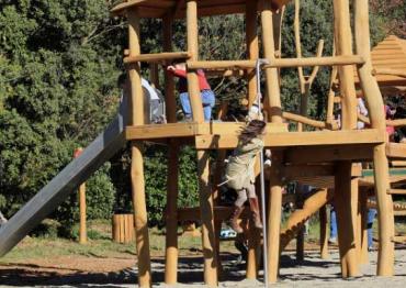 young children on a wooden playground