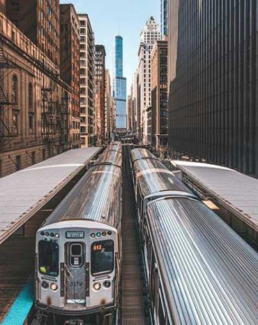 Aerial view of a train going through a city