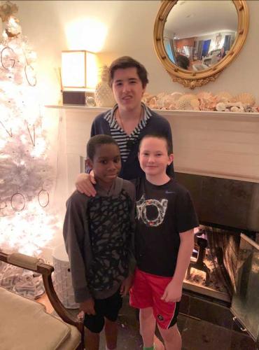 Ainsworth, Kenny and Everett in front of a white Christmas tree