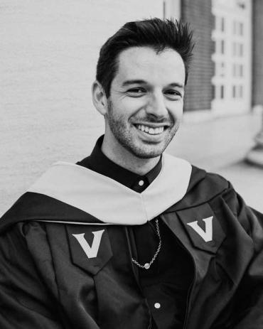 Alex smiling at graduation