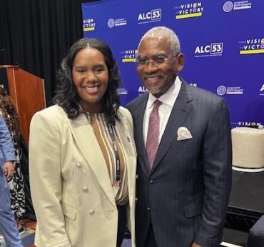 Alyssa Brockington of Autism Speaks standing next to Rep. Gregory Meeks