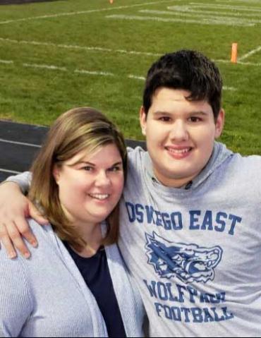 Andrew and his mom at the football stadium