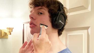 Autistic teen getting his face shaved by his mom with the Gillette TREO razor