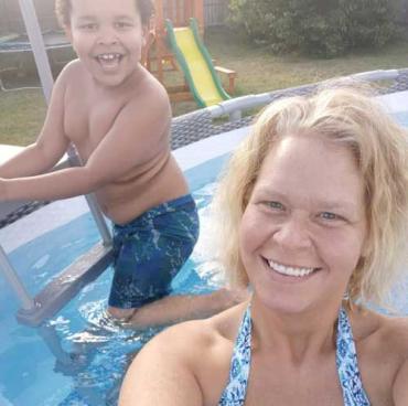 Brandon and his mom in a pool