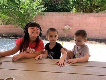 Cody, Colton and Madelyn sitting at a bench