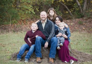 Colleen and her family sitting outside