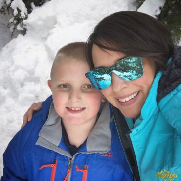 Colleen and her son playing in the snow